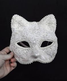 This White Lace Cat Venetian Mask Mardi Gras Carnival Masquerade Costume Ball Bridal Wedding Lent Party is tender, modest and playful at the same time! It is a paper mache mask covered in white lace, transparent sequins, artificial pearls of different sizes, pearly rhinestones and various trim. The sizing would fit an adult or a child, the mask is wide - but please keep in mind that the mannequin in the pictures has a rather narrow face.  The inside of the mask is white and the elastic in the ba Elegant White Masquerade Mask For Weddings, Elegant White Wedding Masquerade Mask, Masquarede Ball Masks, Masquerade Ball Costume, Cat Masquerade Mask, Narrow Face, Carnival Masquerade, Ball Costume, Masquerade Outfit