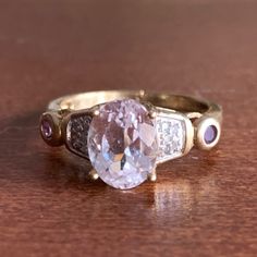 Beautiful Vintage Ring , In Solid 10k Yellow Gold (Stamped And Tested) With Oval Pastel Pink Kunzite Stone, Tiny Pave Diamonds And Small Pink Tourmalines On Each Side. The Oval Stone Is Approx. 9mm By 7mm In Size. The Diamonds Are Just Pave, But They Do Add Some Sparkle When Hand Is Moving. There Is Also A Manufacturer Stamp Inside. This Ring Is A Size 6.25 On Ring Mandrel, Weights 2.78 Grams. The Color Is Very Pastel Pink , So Soft And Beautiful. Very Feminine Ring, Can Also Be Used As An Alternative Engagement Ring ,Especially If You Are A Pink Lover Or A Young Couple On A Budget , It Will Be A Beautiful Ring! Classic Oval Multi-stone Amethyst Ring, Classic Multi-stone Amethyst Ring, Tourmaline Ring Engagement, Ring Mandrel, Dope Jewelry Accessories, Tourmaline Engagement Ring, Pink Engagement Ring, Beautiful Rings Vintage, Pink Kunzite