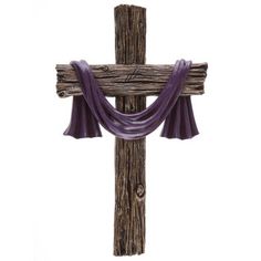 a wooden cross with purple cloth draped around it