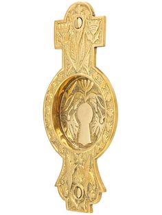 an ornate gold door handle with a keyhole and decorative design on the front, set against a white background