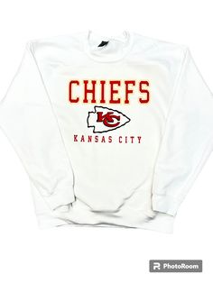 ATTENTION KC fans!  This is a DTG - direct to garment printed ink sweatshirt.  This is printed on a Gildan sweatshirt- unisex in sizing.  Please message with any questions at all. Heavy Blend Crewneck Sweatshirt 8-ounce, 50/50 cotton/poly Double-needle stitching at waistband and cuffs 1x1 rib knit collar, cuffs and waistband with spandex Fan Apparel Fleece Sweatshirt With Logo Print, Fleece Fan Apparel Sweatshirt With Logo Print, Logo Print Fleece Sweatshirt For Fans, Fan Merchandise Cotton Hoodie With Crew Neck, Fleece Sweatshirt With Logo For Fans, Cotton Hoodie Crew Neck For Fan Merchandise, Cotton Crew Neck Hoodie For Fan Merchandise, Fan Apparel Sweatshirt With Logo Print, Fan Merchandise Sweatshirt With Logo Print