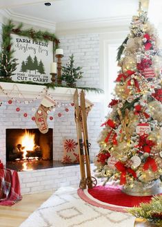 a decorated christmas tree in front of a fireplace