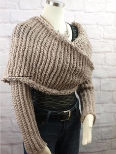 a mannequin wearing a knitted sweater and jeans