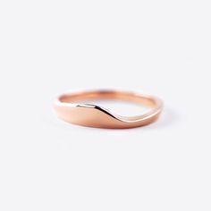 The Agnes Wedding Band is a the companion to our new Iris Engagement Ring. The design compliments the Iris ring with its delicate, elegant design. It is perfect for those who prefer a minimalist approach to wedding bands, this ring perfectly completes Iris and creates the perfect union. Dimensions: 0.75" x 0.25 x 0.475" Available In: 14K Rose Gold, 18k Yellow Gold, 18K White Gold, Platinum Wedding Rings With Smooth Finish And Round Band, Wedding Rings With Smooth Finish, Minimalist Wedding Bands With Smooth Finish, Rose Gold Simple Rings For Formal Occasions, Minimalist Wedding Jewelry With Smooth Finish, Simple Rose Gold Rings For Formal Occasions, Timeless Smooth Finish Wedding Rings, Minimalist Smooth Finish Wedding Jewelry, Rose Gold Stackable Rings For Formal Occasions