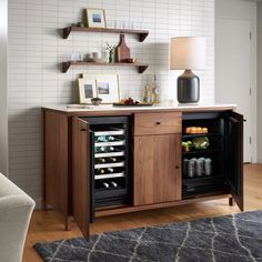 a room with a wine cooler and shelves on the wall