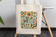 Elevate your style with this stunning midcentury modern shoulder bag! 🌟✨ Featuring a bold and colorful geometric design, this retro 70's inspired tote is perfect for the chic, boho-loving girlfriend in your life. Its unique pattern makes it a standout piece, ideal for carrying your favorite books or essentials while adding a touch of vintage charm to your outfit. Whether you're heading to the market, a casual outing, or a summer adventure, this shoulder bag combines practicality with eye-catchi Retro Everyday Rectangular Shoulder Bag, Retro Rectangular Shoulder Bag For Everyday, Retro Square Shoulder Bag For Everyday, Retro Crochet Shoulder Bag, Retro Flap Shoulder Bag, Square Retro Shoulder Bag, Retro Everyday Shoulder Bag, Retro Shoulder Bag For Everyday Use, Mid-century Rectangular Shoulder Bag For Daily Use