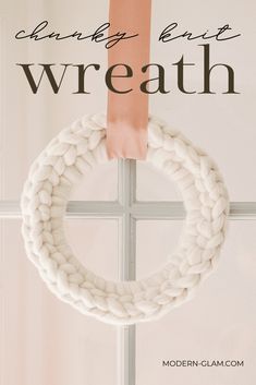 a white wreath hanging from the side of a window with text overlay that reads, crochet knot wreath