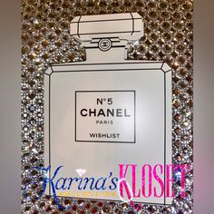 chanel no 5 perfume bottle on display with crystal beads around it and the label