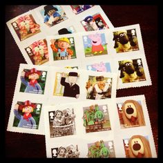 several postage stamps with pictures of people and animals on them, all in different shapes and sizes