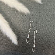 Unique Earrings Silver, Dangling Silver Earrings, Silver Sparkling Long Drop Crystal Earrings, Sparkling Silver Long Drop Crystal Earrings, Single Long Drop Crystal Earring, Elegant Faceted Crystal Dangle Earrings, Crystal Earrings With Dangling Beads For Wedding, Sparkling Long Drop Crystal Earrings, Elegant Dangle Earrings With Faceted Beads