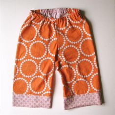 an orange and white pants with circles on it