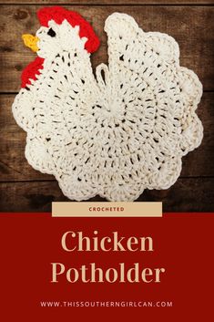 the chicken potholder is crocheted and sits on top of a wooden table