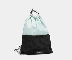 a black and mint green drawsack bag