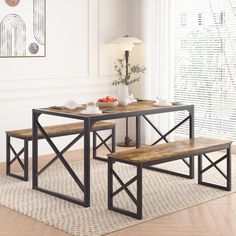 a dining table with two benches in front of it on top of a carpeted floor