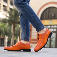 Elegant, refined, and undeniably suave, these stylish orange mens dress shoes feature a timeless formal silhouette in a variety of vibrant hues such as red, purple, gold, burgundy, navy blue, royal blue, and brown. Our exclusive Viotti collection also offers more muted colors for a sophisticated look that's perfect for any occasion. Elevate your special event attire with our patent leather derby shoes and add a touch of personality to your office attire, or coordinate with your suit for a polish