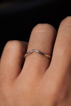 A curved arc stacking ring made from Sterling Silver Metal. After countless requests and some fine tuning, we finally perfected this ring shape! The Teardrop Ring stacks with all of our rings beautifully. It adds dimension to any stacking rings you wear daily but it also makes the perfect, low-key wedding band! The bend in the Teardrop Ring curves to hug a set stone beautifully if you are looking for a complimentary piece for your existing engagement ring. This listing is for ONE SINGLE RING.Made from solid STERLING SILVER metal.Available in a SMOOTH or HAMMERED texture. The smooth finish is fully round metal.Each ring measures approximately 1.75 mm in width. We recommend stacking the Teardrop Ring with the Pebble Ring, one of our favorite dimensional pieces inspired by precious stone ring Minimalist Teardrop Stackable Jewelry, Minimalist Sterling Silver Teardrop Rings, Dainty Hand Forged Rings For Everyday, Dainty Teardrop Adjustable Rings, Minimalist 14k Gold Teardrop Ring, Hand Forged Stackable Rings For Anniversary, Minimalist Curved Wedding Rings, Teardrop Stackable Adjustable Rings, Elegant Sterling Silver Teardrop Stackable Rings