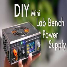 a person holding an electronic device with the words diy mini lab bench power supply