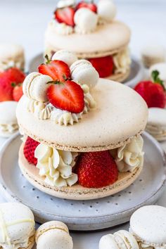 there are three cakes with strawberries on top