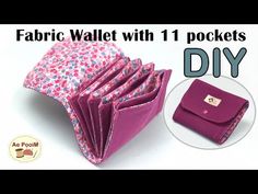 an open wallet sitting on top of a table next to a small purse with the words fabric wallet with 1 pockets