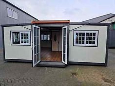 the inside of a portable home with its doors open