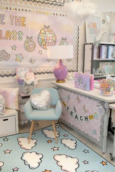 a child's room with a desk, chair and wall hangings on the walls