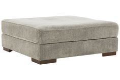 the footstool is upholstered and ready to be used as an ottoman