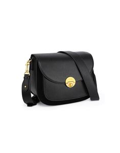 a black cross body bag with a gold buckle on the front and strap around it