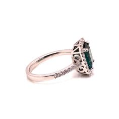 Introducing a stunning Brazilian Green Tourmaline and Diamond Dinner Ring, a timeless piece that exudes elegance and sophistication. This exquisite ring features a gleaming emerald-cut bluish-green Tourmaline, measuring 8.25 x 7.5 MM and weighing an estimated 2 carats. The center stone is beautifully enhanced by a dazzling pave diamond halo (estimated 0.35 carat total weight), with G/H color and SI2 clarity, and additional diamonds adorning the shank. Set in a handcrafted 14K white gold setting, this ring is a size 6.5 (no alterations by the seller).  Tourmaline is a gemstone of extraordinary color, often mistaken for rubies or emeralds before being officially recognized in the 1800s. Few gems can match Tourmaline's vibrant spectrum, with each color holding unique symbolism. Green Tourmali Formal Radiant Cut May Birthstone Ring, Formal Emerald Halo Ring Fine Jewelry, Formal Radiant Cut Ring With May Birthstone, Formal Emerald Cut Emerald Ring With Halo, Formal Emerald Cut Sapphire Ring With Accent Stones, Formal Emerald-cut Sapphire Ring With Accent Stones, Elegant Radiant Cut Emerald Ring For Formal Occasions, Classic Emerald Cut Halo Emerald Ring, Formal Emerald-cut Sapphire Ring With Halo Design