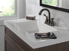 the bathroom sink is clean and ready to be used by someone in their home or business