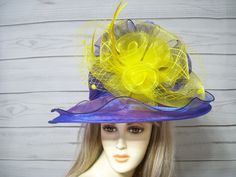 "Beautiful Purple iridescent wide brim organza hat matching bow and a large yellow rosette accent. This hat is 22.5\" for the inside circumference with a built-in hat sizer. I cannot make this hat bigger. I have lots of hats available in my shop. Thank you for stopping by.   All sales are FINAL! No returns, exchanges or returns. Please get that in mind when purchasing. Thank you. A lot more items in my shop: https://www.etsy.com/shop/MsPurdy I ship many times during the week. If you have any questions please message me. International buyers are responsible for custom fees as it is not included in the shipping. I accept Paypal, credit cards and etsy gift cards. International buyers: Please know that you will be held responsible for any CUSTOMS FEES. Please check with you local post office, Stevie Nicks Costume, Race Day Hats, Purple Hat, Easter Hats, Hat Wedding, Purple Hats, Yellow Hat, Wedding Hat, Pirate Hats