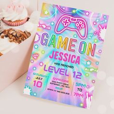 a game on birthday party with cupcakes and other treats in a box next to it