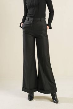 A woven pant with flare leg Details: Self: 97% Polyester 3% Spandex Size & Fit - Model is 5`8" And Wearing Size Small- Measurements Taken From Size Small- Approx. Length: 42" Inseam- 30" Black Wide-leg Flares For Workwear, Black Stretch Flares For Fall, Elegant Black High-waisted Flare Pants, Elegant Black High-waisted Flares, Black Wide Leg Flares For Spring, Chic Black Flares For Fall, Spring Workwear Wide Leg Flares, Black Flared Wide Leg Pants For Formal Occasions, Chic Black Flare Trousers