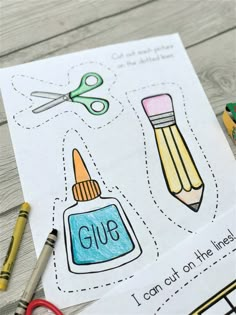 an activity book with pencils, scissors and glue on the pages that are cut out