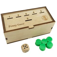 a wooden box with four dices in it and two numbers on the front side