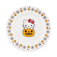 a hello kitty plate with pumpkins and skulls on it