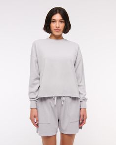 Comfy long-sleeve tee in our softAF fabric and oversized-fit silhouette, featuring an all-over grid micro-waffle texture, crew neckline and straight hem. Spring Boxy Fit Sweatshirt For Layering, Oversized Tops With Soft Texture, Long Sleeve Athleisure Tops For Everyday, Gray Relaxed Fit Long Sleeve Crew Neck Top, Gray Long Sleeve Top Relaxed Fit Crew Neck, Gray Relaxed Fit Long Sleeve Top With Crew Neck, Relaxed Long Sleeve Sweatshirt For Loungewear, Gray Long Sleeve Top With Relaxed Fit, Relaxed Tops With Ribbed Cuffs For Loungewear