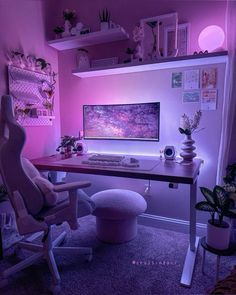 a desk with a computer on it in front of a purple wall and some potted plants