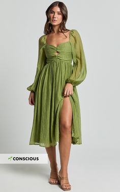 Elevate your style with our Zahara Midi Dress, a masterpiece that redefines elegance in every thread. This stunning Blouson Sleeve Cut Out Dress, in a vibrant shade of green, is more than just a piece of clothing it's a statement of empowerment and individuality designed to highlight the unique beauty of every woman. Crafted from luxurious textured woven Tencel, this eco-conscious fabric not only feels good on your skin but also aligns with your values, supporting sustainable fashion choices. Product Details: Zips detail Inner lining A-line dress Textured woven fabric V-neck Party day perfect Midi length Long sleeve Made from Tencel. Size and Fit Size S / 8 length: 115.5cm / 45.47in Material and Care Main Fabric: 75% Tencel, 25% Nylon Lining: 100% Rayon No Stretch Draping Dress, Red Sequin Dress, Basic Black Dress, Green Outfits, Neon Outfits, Spring Maxi Dress, Bachelorette Dress, Wedding Green, Navy Bridesmaid Dresses