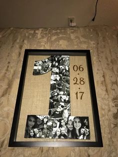 the number one made out of photos is displayed in front of a bed with a wall hanging