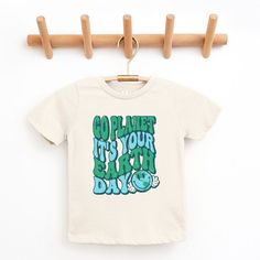 Looking for a cute tee for your kids? We have the perfect Go Planet graphic tee addition to their closet! Also available in toddler tees. Playful Slogan Crew Neck T-shirt, Playful Slogan T-shirt With Crew Neck, Cute Organic Cotton Crew Neck T-shirt, Playful Organic Cotton Graphic T-shirt, Casual Letter Print T-shirt For Playtime, Cute Letter Print T-shirt For Playtime, Screen Print Short Sleeve T-shirt For Playtime, Trendy Spring Playtime T-shirt, Green Cartoon Print T-shirt For Playtime