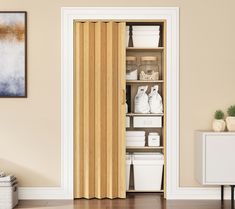 an open door in a room with white containers and other items on the shelves next to it