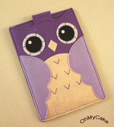 an applique on the side of a cell phone case that is made to look like an owl