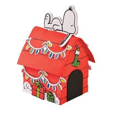 a red house with a snoopy christmas decoration on it's roof and windows