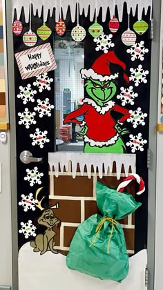 the grinch door is decorated with christmas decorations