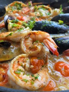 some shrimp and mussels are in a bowl