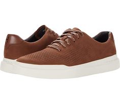 Cole Haan Grandpro Rally Laser Cut Sneaker - Men's Shoes : Chestnut Nubuck : Enjoy the breezy comfort and breathability of the Cole Haan Grandpro Rally Laser Cut Sneaker. Made of leather with a perforated front and smooth back with a lace-up design. Textile lining with cushioned footbed. Rubber outsole. Imported. Measurements: Weight: 11.8 oz Product measurements were taken using size 10, width D - Medium. Please note that measurements may vary by size. Weight of footwear is based on a single it Leather Athleisure Walking Shoes For Light Sports, Leather Low-top Athleisure Walking Shoes, Leather Low-top Walking Shoes In Athleisure Style, Athleisure Leather Low-top Walking Shoes, Sporty Perforated Walking Sneakers, Sporty Walking Sneakers With Perforations, Comfortable Brown Sneakers With Perforated Toe Box, Leather Walking Shoes With Perforated Toe For Light Sports, Leather Walking Shoes For Light Sports