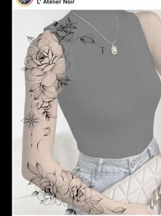 a woman's arm with flowers on it