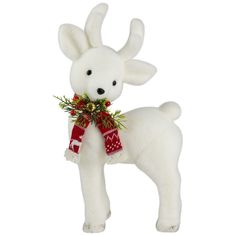 a white stuffed animal with a red scarf around it's neck and nose is standing upright