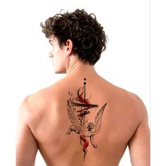 a man with a tattoo on his back