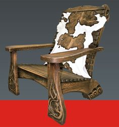 an old wooden chair with cow hide on it's back and seat, sitting in front of a red background